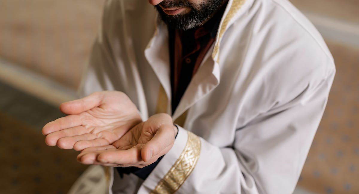 man praying and going on hajj