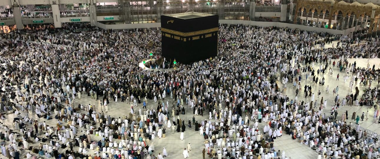 peoples are gathered at the great grand mosque in makkah